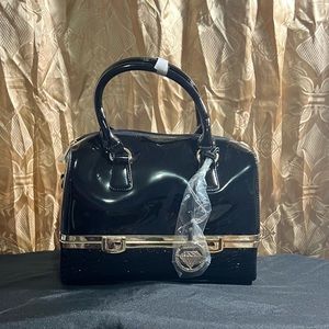 Black leather bag… opens up at the bottom